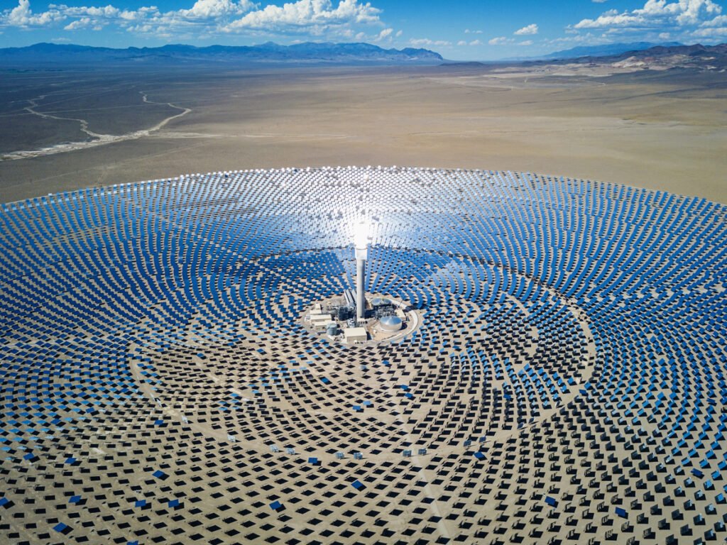 High Aerial view of large solar thermal power plant farm in the desert. Solar thermal power station.