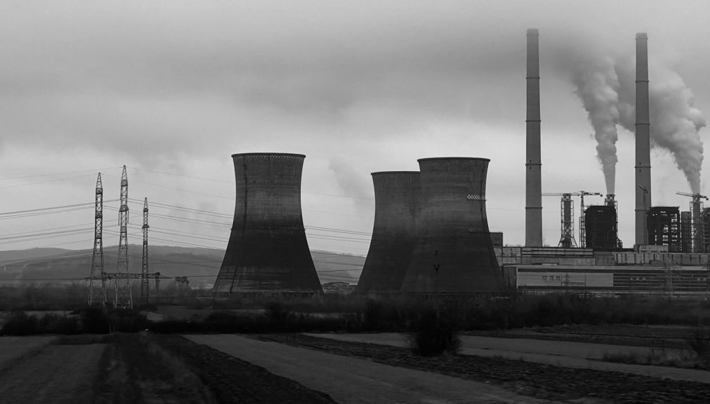 industrial landscape with cooling towers and chimneys