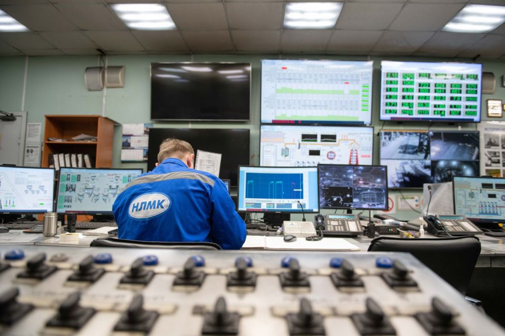 engineer at control room monitoring screens
